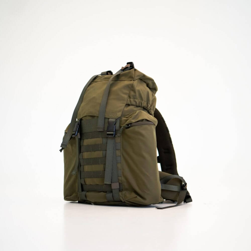 a backpack sitting on a white surface.
