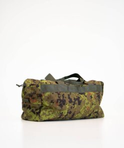 a duffel bag sitting on a white surface.