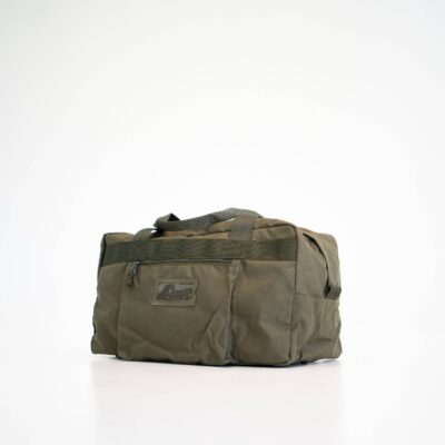 a duffel bag sitting on top of a white floor.