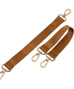 a pair of caramel colored suspenders with metal hooks.
