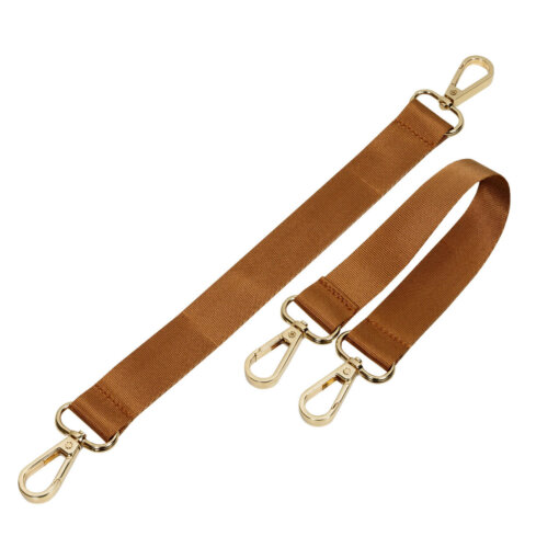 a pair of caramel colored straps with metal hooks.
