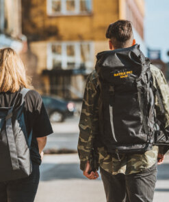 a man and a woman walking down the street.
