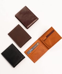 three different types of wallets on a white surface.