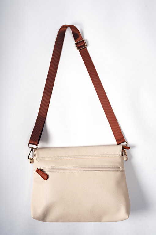 a white purse with a brown strap hanging from it.
