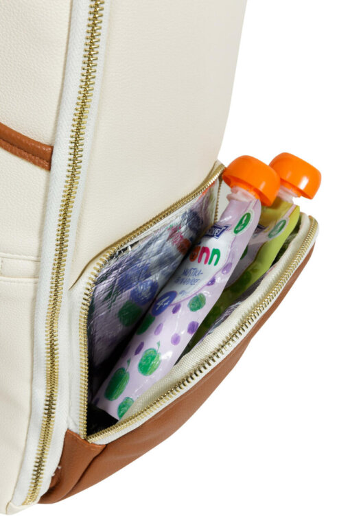 a white backpack with toothbrushes and toothpaste in it.