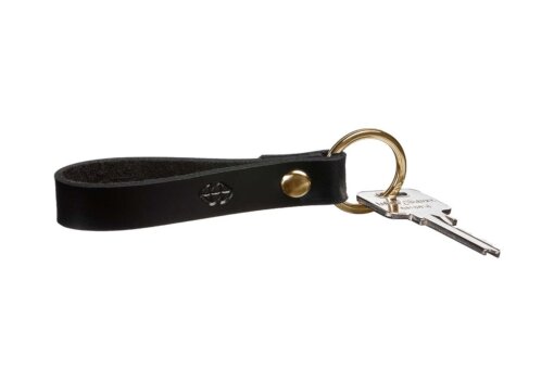 a black leather key fobring with a gold ring.