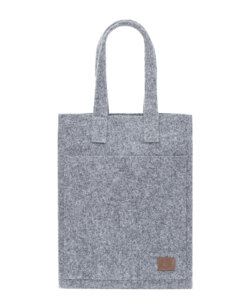 a gray tote bag with a brown leather handle.