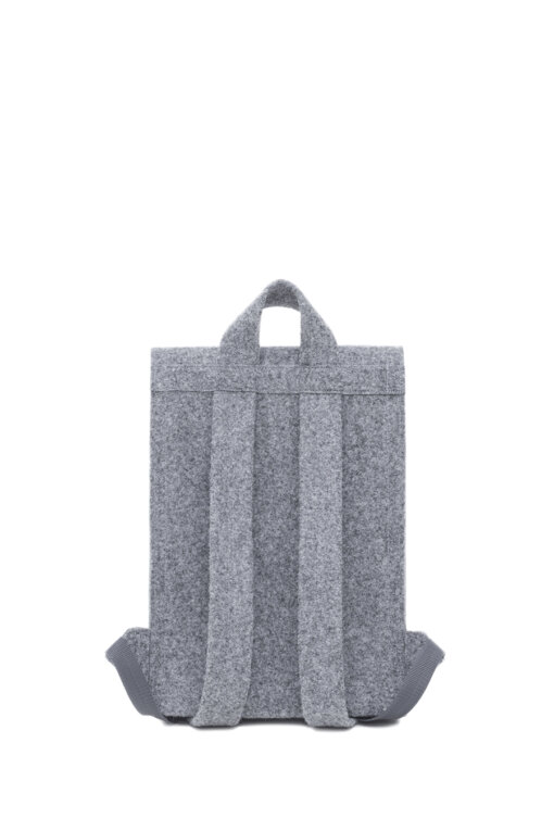a gray backpack sitting on top of a white surface.