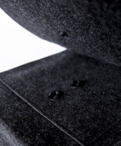 a close up of a black object on a white surface.