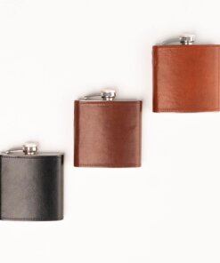 a couple of leather flasks sitting next to each other.