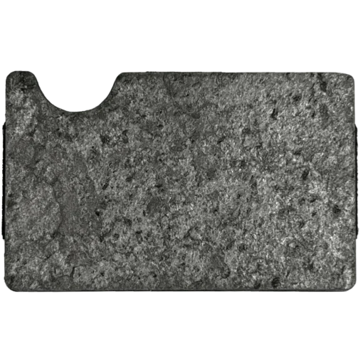 a black and white photo of a piece of concrete.