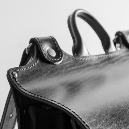 a black and white photo of a handbag.