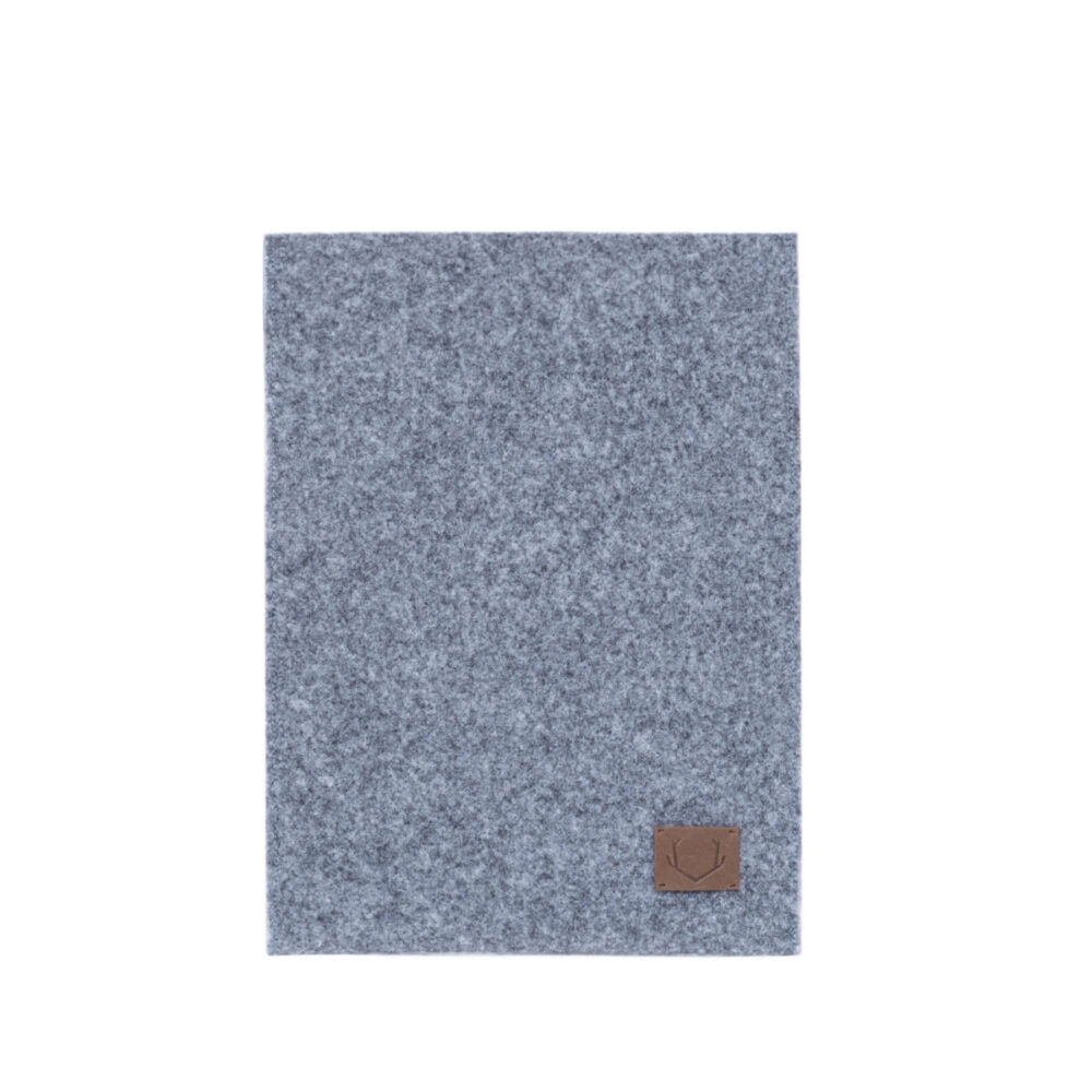 a gray blanket with a brown patch on it.