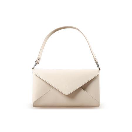 a white handbag with an envelope inside.