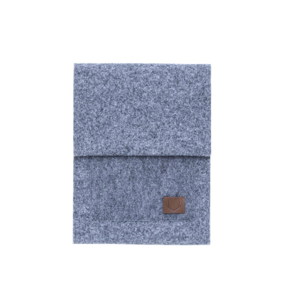 a blue blanket with a brown leather patch on it.