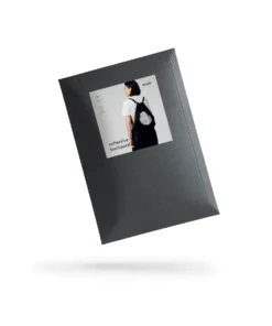 an open book with a picture of a woman in a black dress.