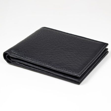 a black leather wallet sitting on top of a white table.