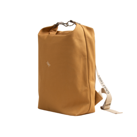 a brown garment bag with a white tag on it.