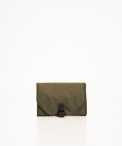 a brown purse sitting on top of a white table.