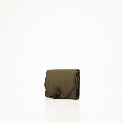 a black purse sitting on top of a white floor.