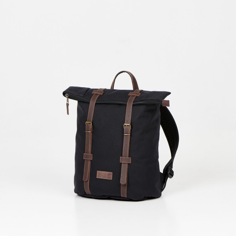 a black backpack with brown straps on a white background.