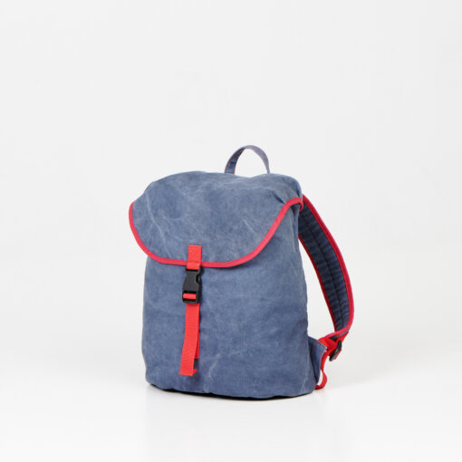 a small blue backpack with a red strap.
