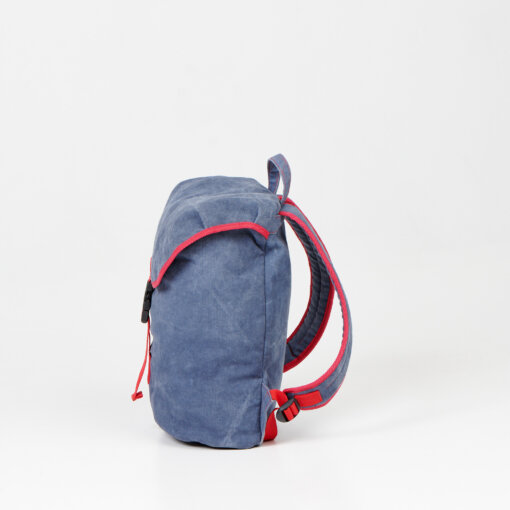 a blue backpack with a red strap on a white background.