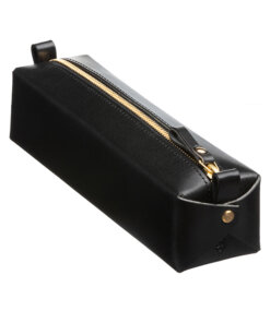 a black leather case with a gold zipper.