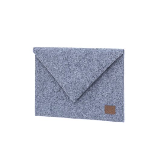 a gray blanket with a brown leather patch on it.