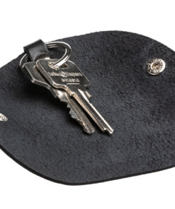 a pair of keys sitting on top of a black mat.