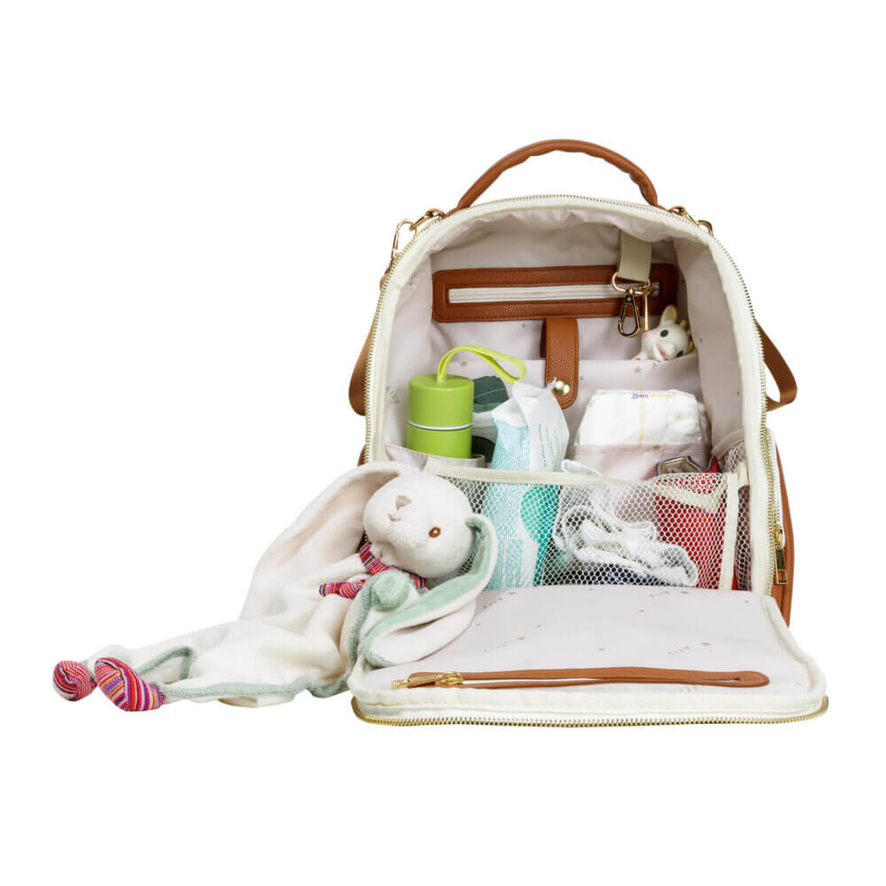 a diaper bag filled with baby items on a white background.