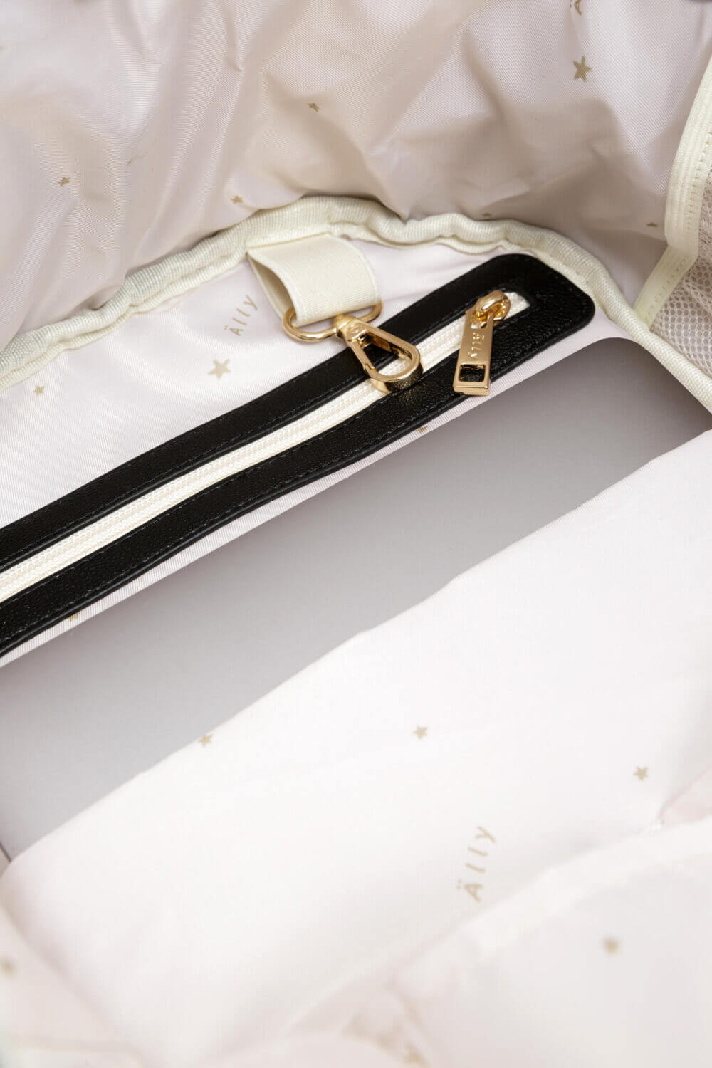 a black and white purse with a gold buckle.