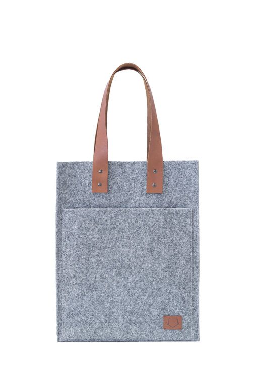 a gray tote bag with a brown leather handle.