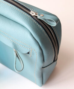 A DOUGLAS Toiletry Bag - Turquoise with a zipper on it.