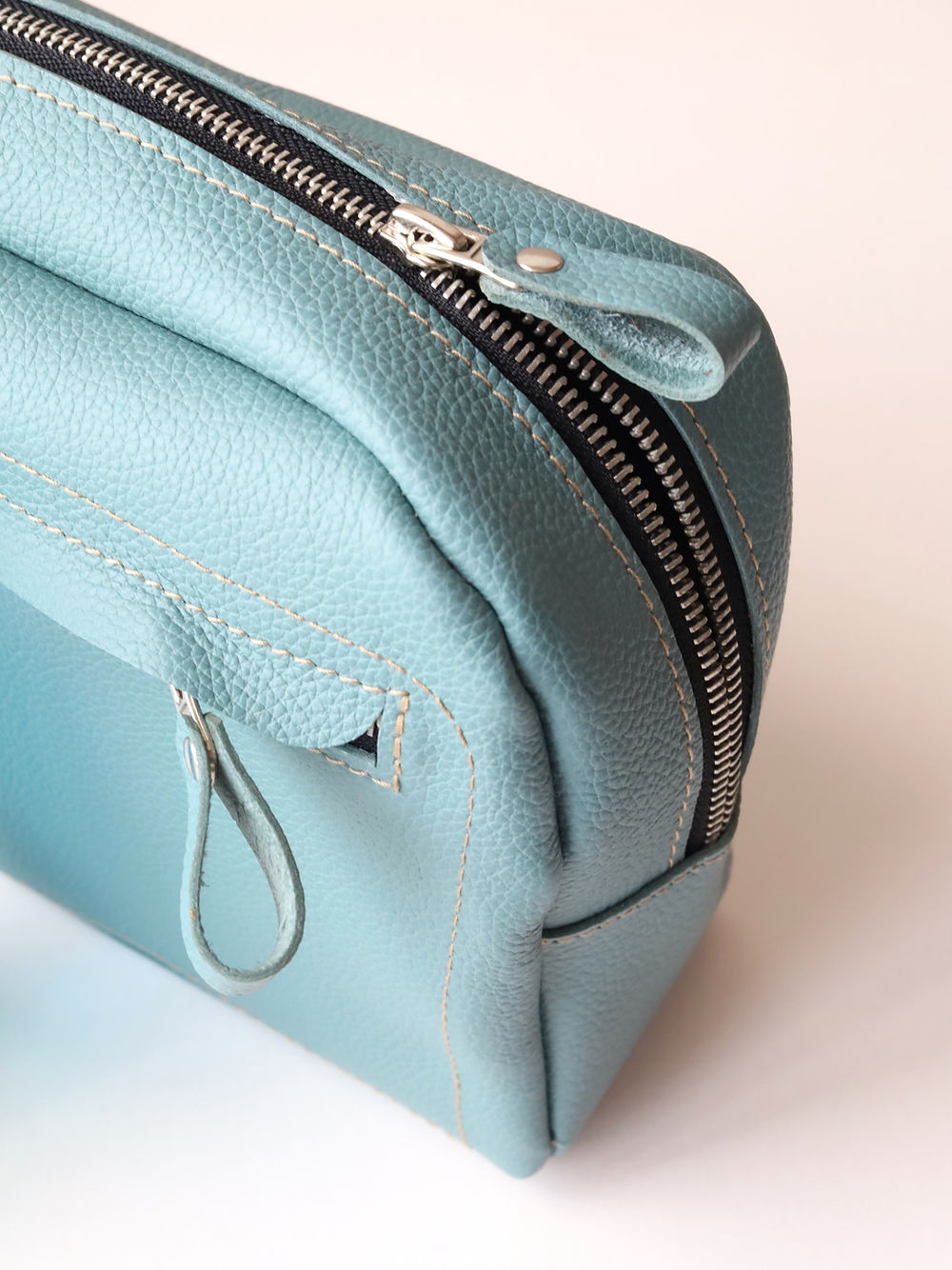A DOUGLAS Toiletry Bag - Turquoise with a zipper on it.