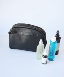 A DOUGLAS Toiletry Bag - Black with several items inside.