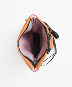 The inside of a Barbara Leather Backpack - Peanut with a zipper.