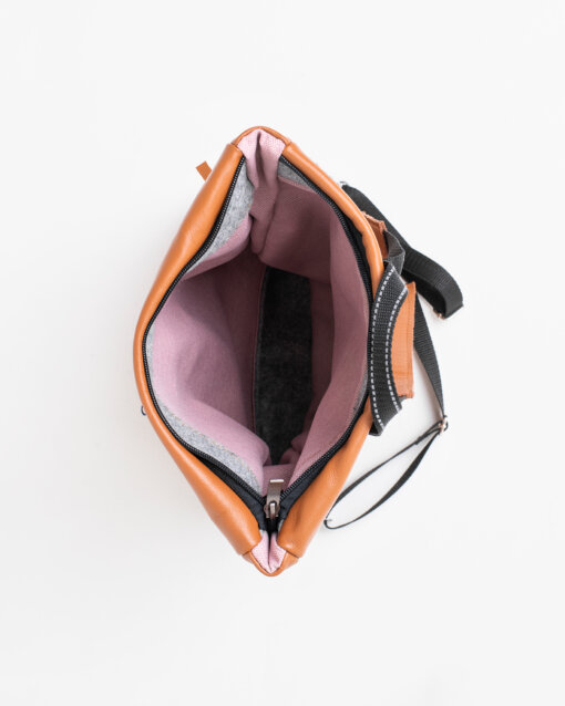 The inside of a Barbara Leather Backpack - Peanut with a zipper.